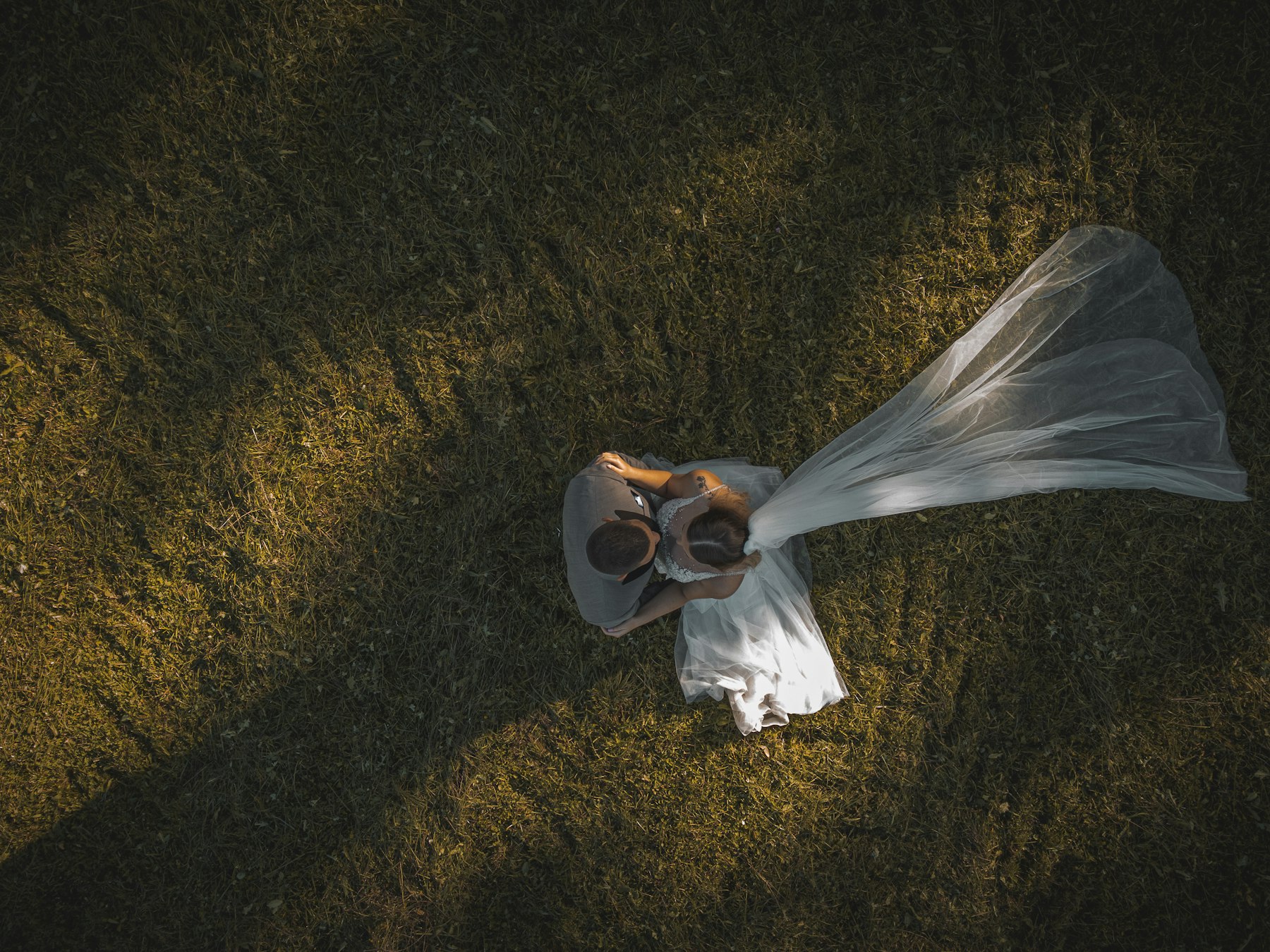 Bridal veil and shoes on the grass
